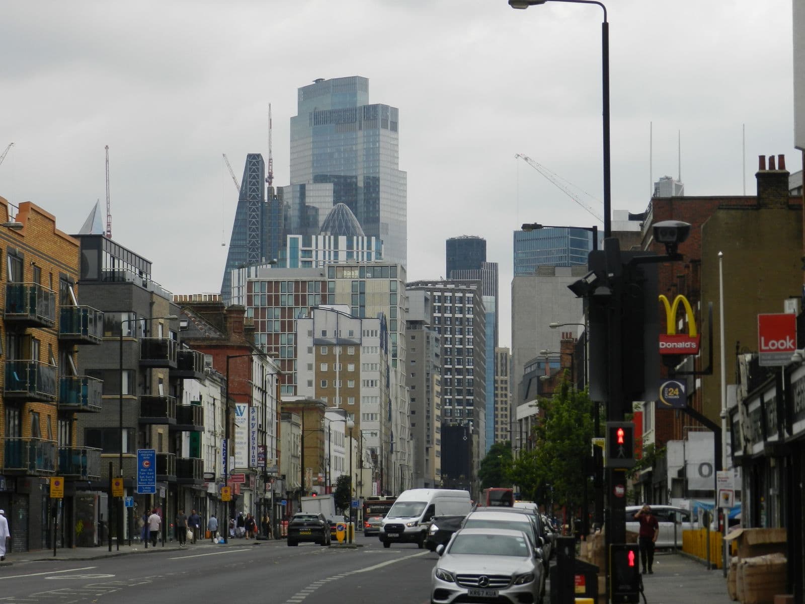 Busy street with modern skyscrapers beyond