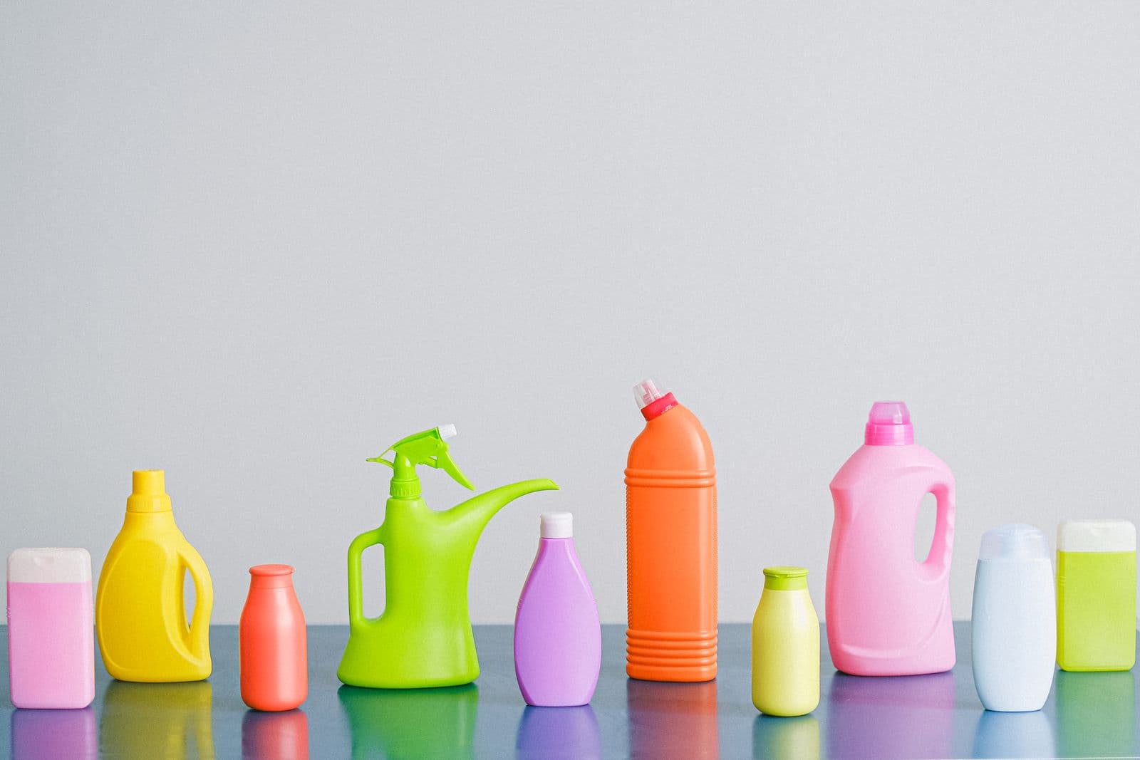 Colourful bottles of cleaning products lined up in a row