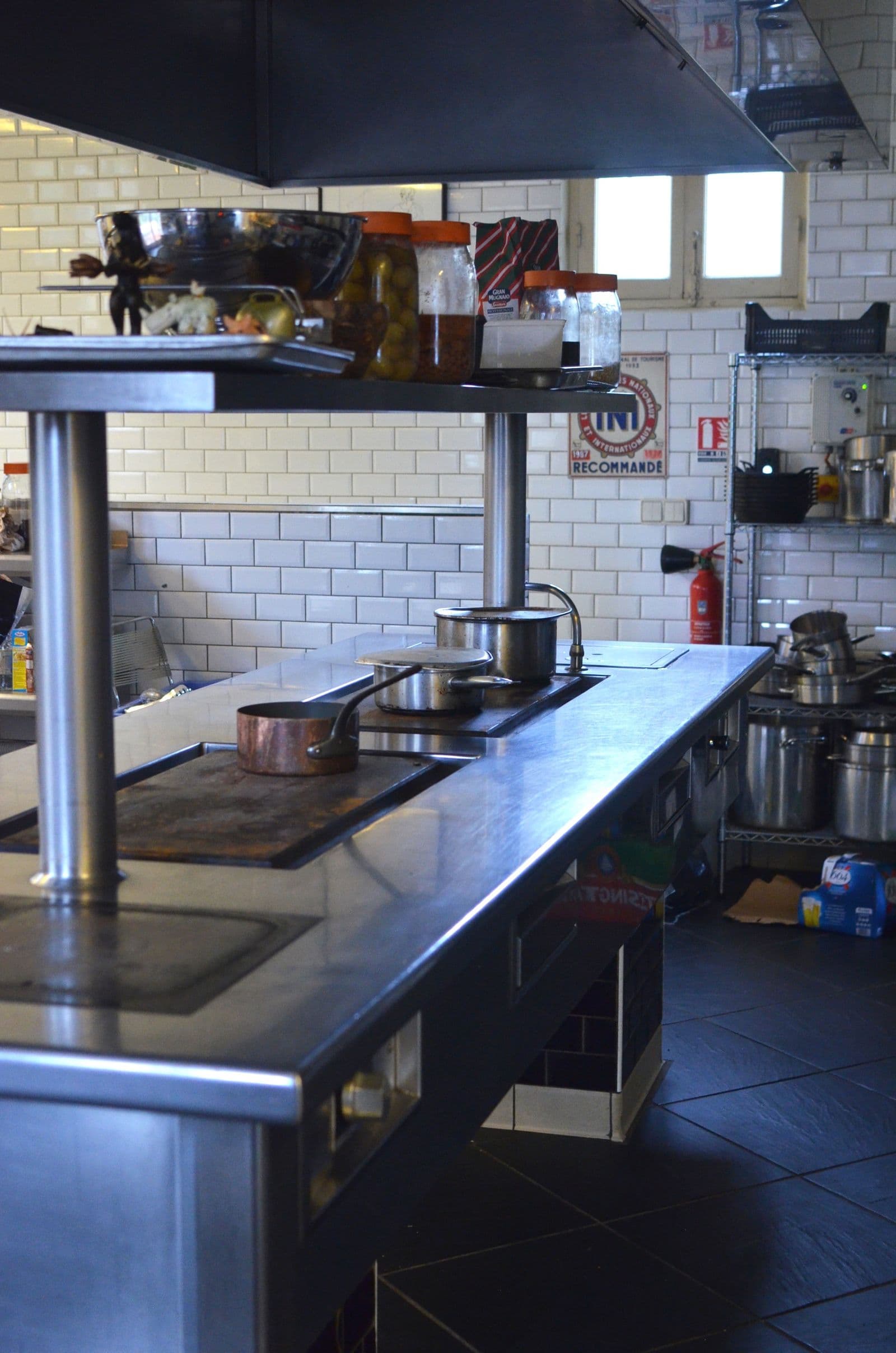 Stainless steel surfaces in an empty commercial kitchen
